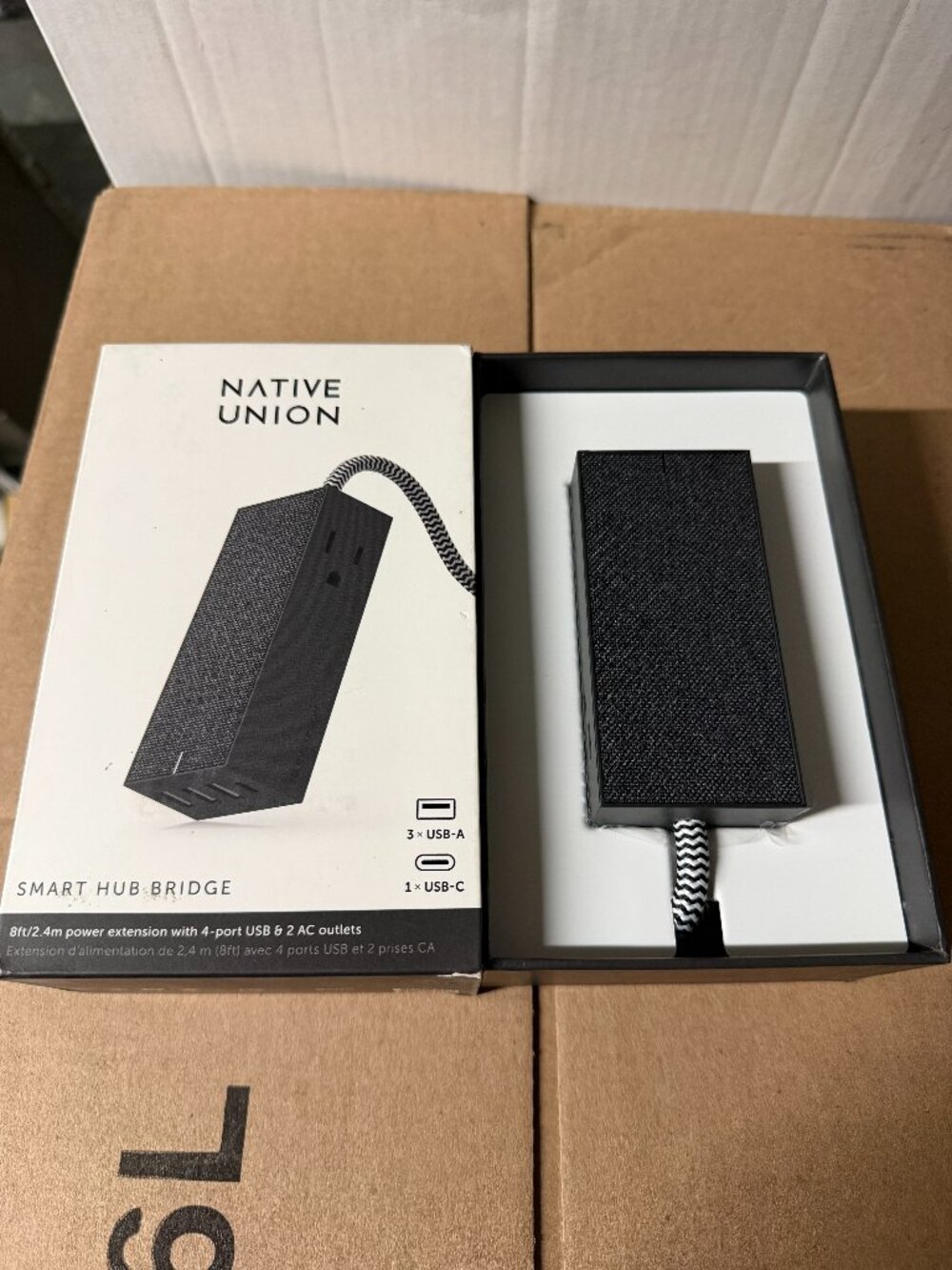The Native Union Smart Hub Bridge Slate is a versatile charging dock that offers